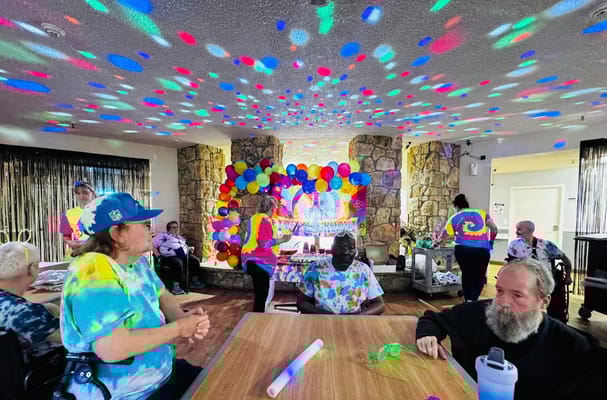 Residents participating in a colorful activity in a common area