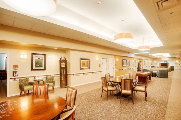 Bright common area with seating and dining tables