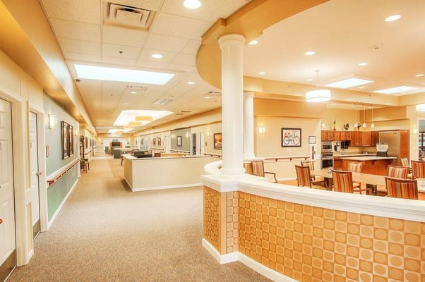 Spacious common area with seating and kitchen in Lincolnshire Place.