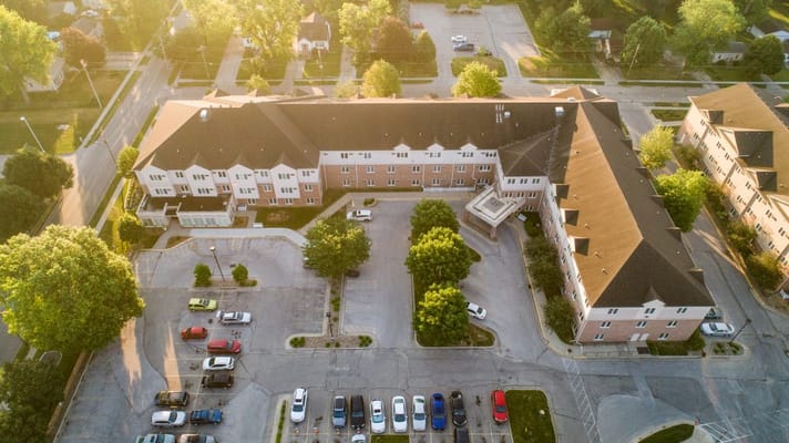 Aerial view of Luther Park Community showing the building and parking area.