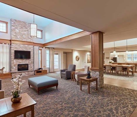 Spacious common area with cozy seating and fireplace