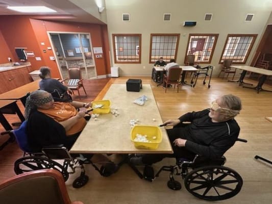Residents engaging in an activity in a common area