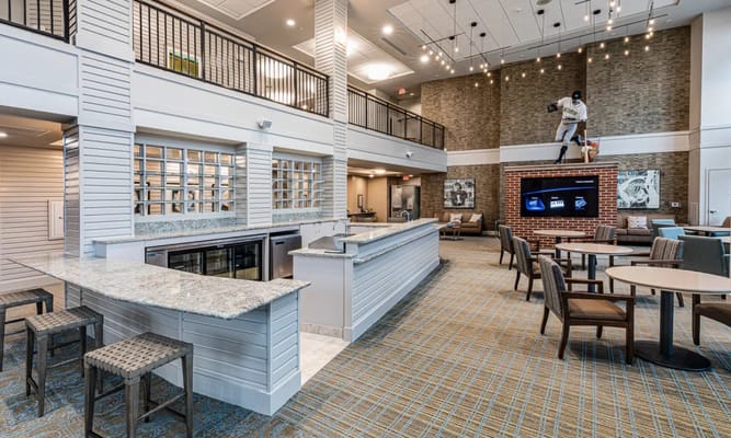 Bright common area with seating and kitchenette