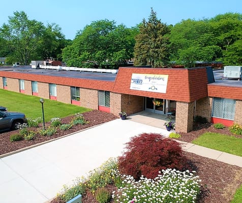 Exterior view of Mission Point nursing facility with entrance signage