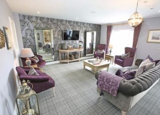 Elegant living room with purple accents and modern decor