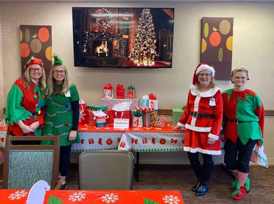 Staff dressed in festive attire during a holiday event