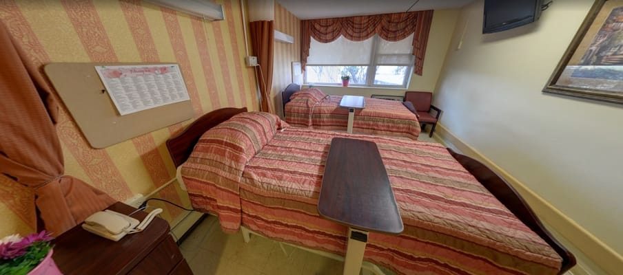 Bedroom with two beds and window at Oakwood Residence