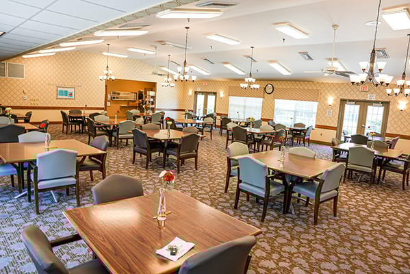 Bright dining area with tables and chairs
