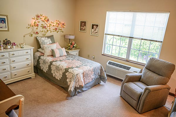 Cozy resident room with floral decor and natural light