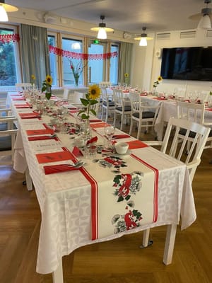 Dining area with elegantly set tables and sunflowers