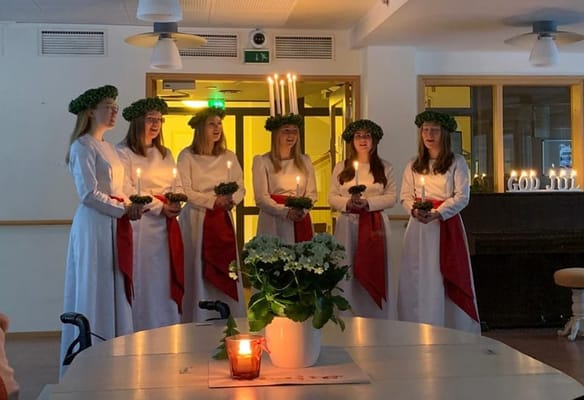 Residents participating in a celebratory group activity indoors