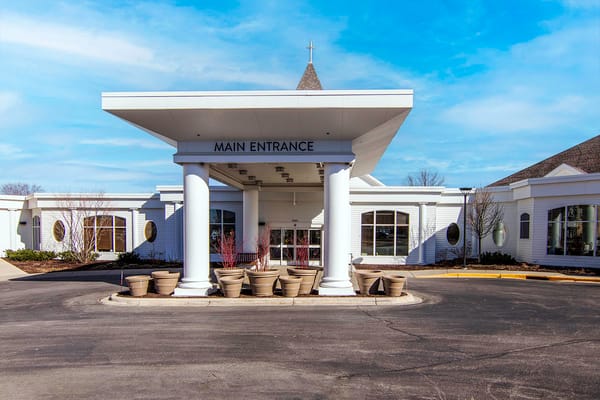 Exterior view of the main entrance with planters