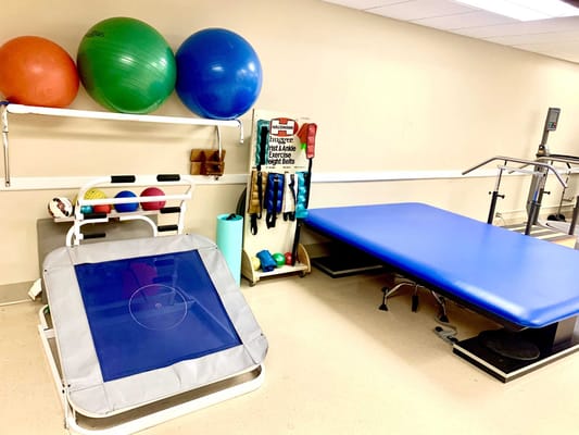 Interior view of a therapy room with equipment