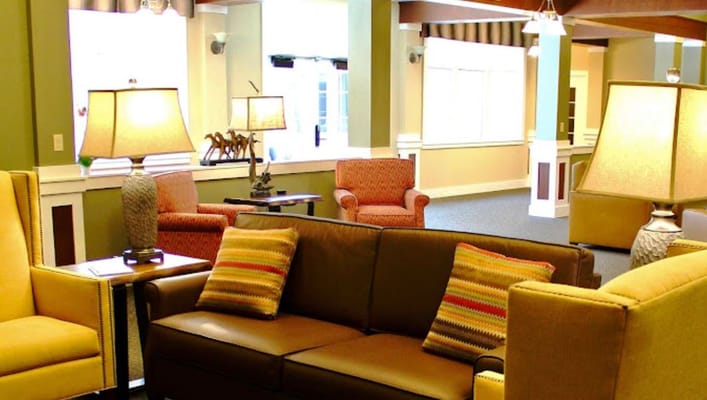 Interior lounge area with seating and lamps