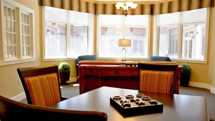 Bright common area with seating and natural light