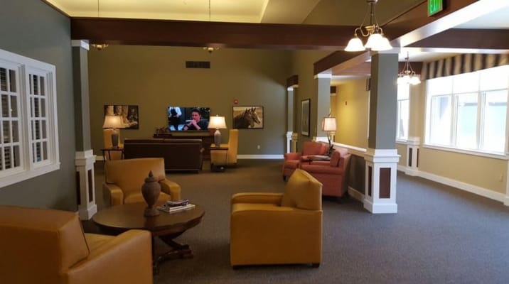 Interior common area with seating and a TV