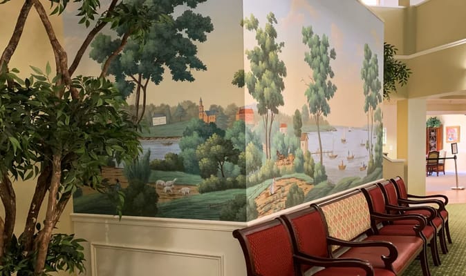 Interior hallway with mural and seating