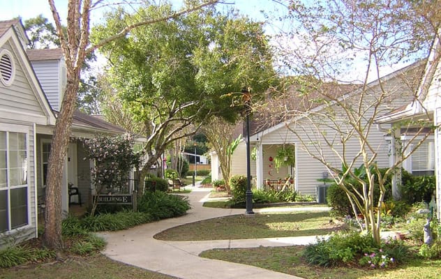Scenic pathway surrounded by buildings and greenery at Southside Gardens
