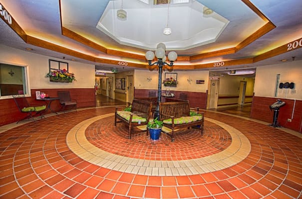 Welcoming lobby with seating area and decorative lighting.