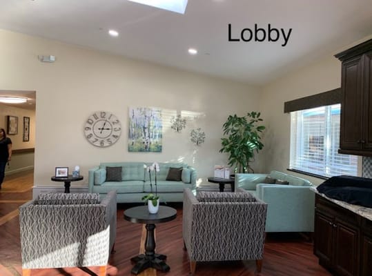 A cozy lobby area with seating and decor at Summit Rehabilitation and Care Community.