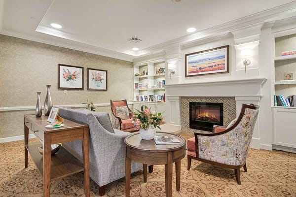 Cozy common area with seating and a fireplace