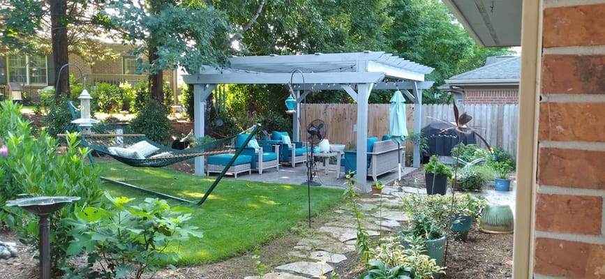 Quaint outdoor space with seating and greenery