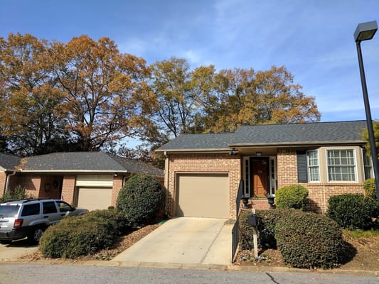 Exterior view of a residential building with autumn trees