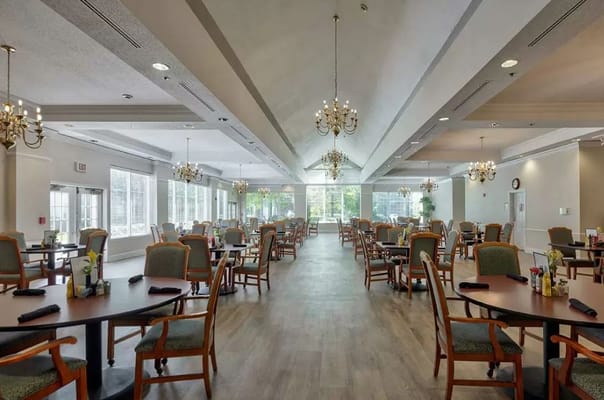 Spacious dining room with tables and chandeliers at TerraBella Windsor Lake