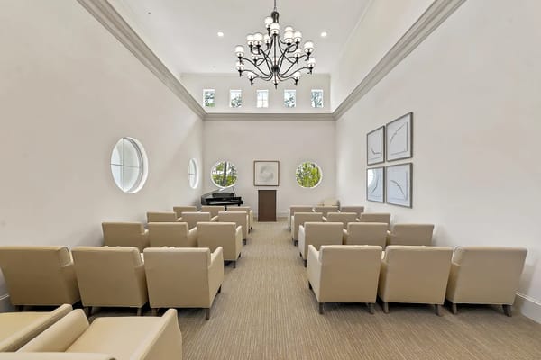 Spacious lounge area with seating and a piano