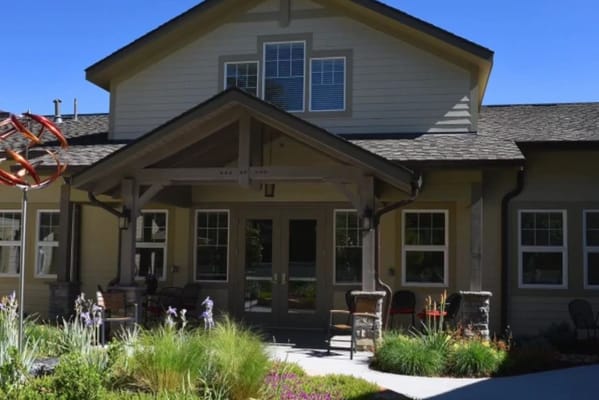 Entrance of a senior living facility with landscaping