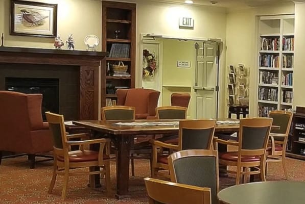 Cozy common area with seating and a fireplace