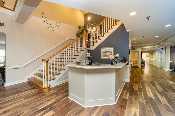 Welcoming interior lobby with stairs and decorative accents