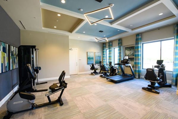 Interior view of a fitness area with exercise equipment