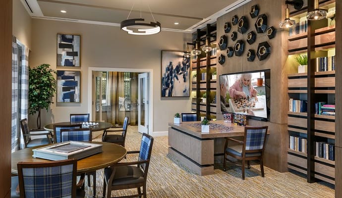 Residents enjoying a group activity in a bright lounge