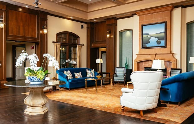 Elegant lobby area with blue sofas and floral arrangements