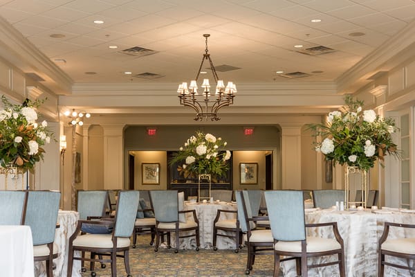 Elegant dining room with floral decor and chandelier