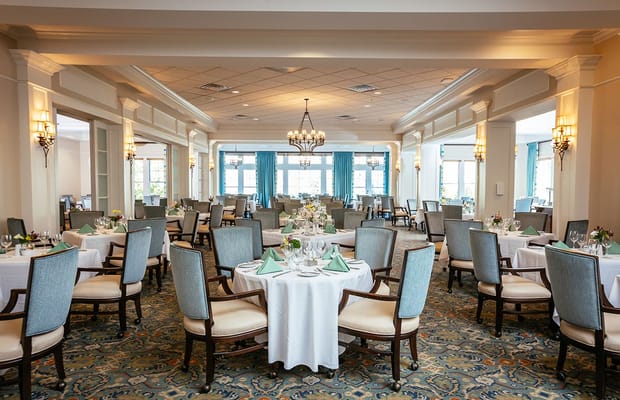 Spacious dining room with elegantly set tables