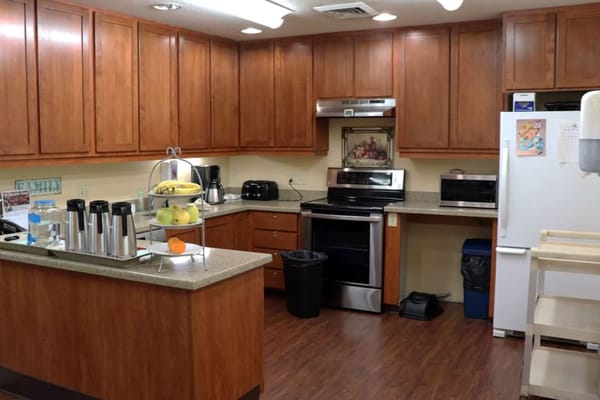 Interior view of a well-lit kitchen in a senior living facility