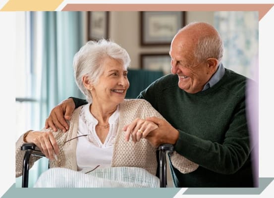 Senior couple smiling and enjoying each other's company in a living space