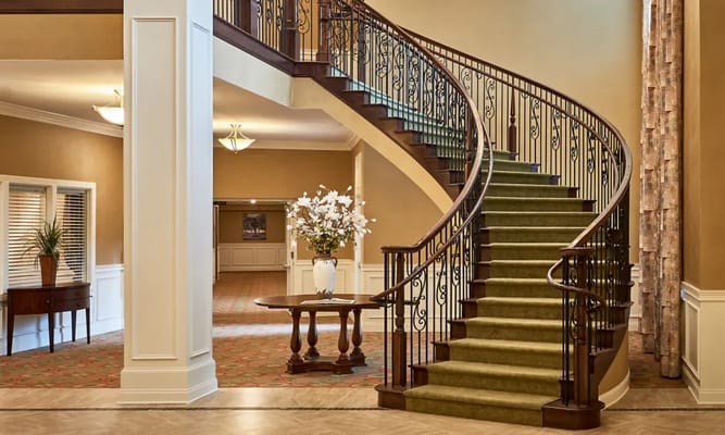 Elegant interior staircase in a senior living facility