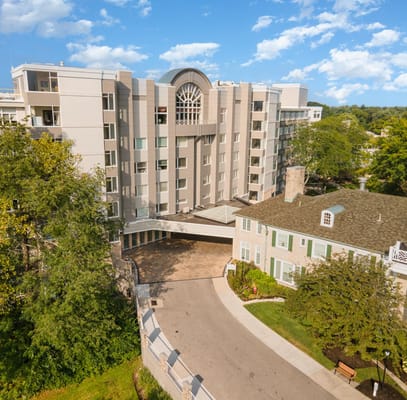 Aerial view of the Wesley Glen senior living facility showing the main building and courtyard.