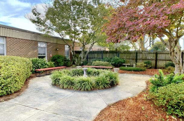 Garden area with seating and shrubs