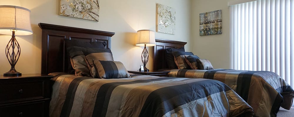 Well-appointed double occupancy room with twin beds