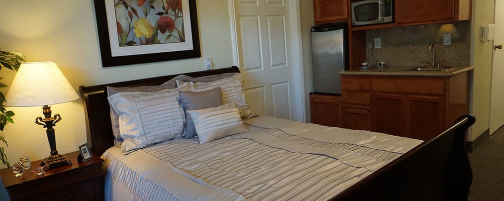 Cozy resident room with a kitchenette and decor