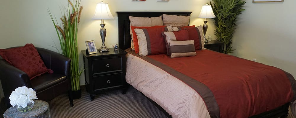 Cozy bedroom with decorative pillows and lamps