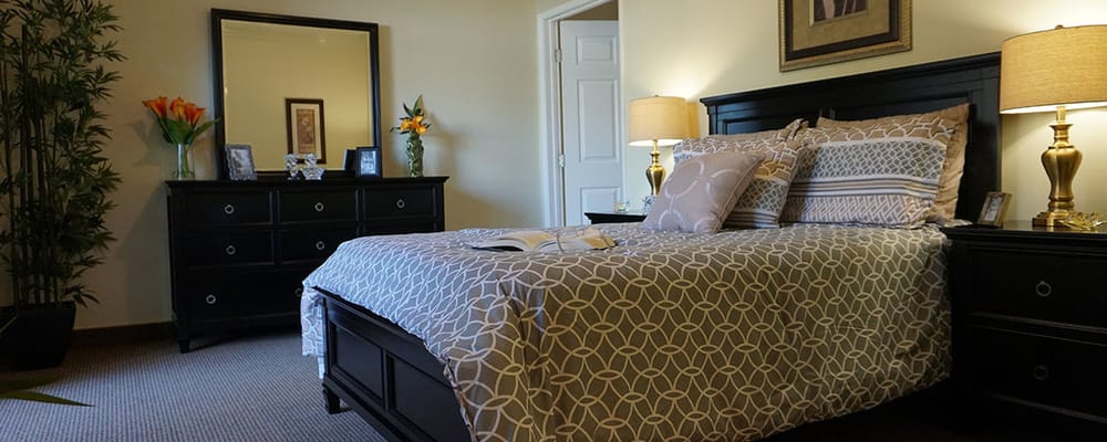 A cozy resident room with a bed and decor