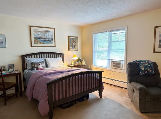 Cozy resident room with a bed and natural light