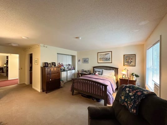 Cozy bedroom with personal decorations and natural light