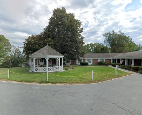 Gazebo in a landscaped area outside the facility