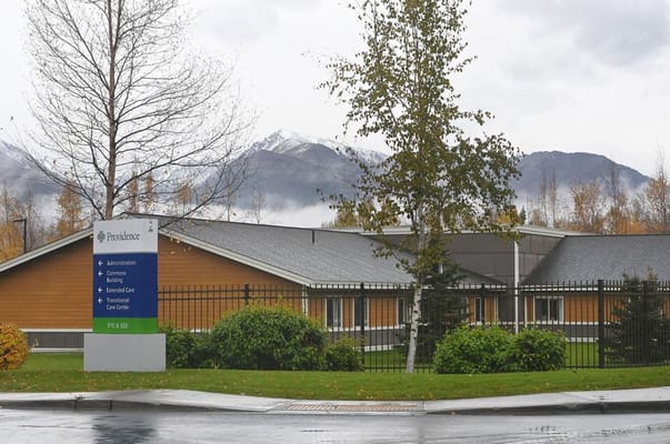 Exterior of Providence Horizon House with landscaping and mountains in the background.